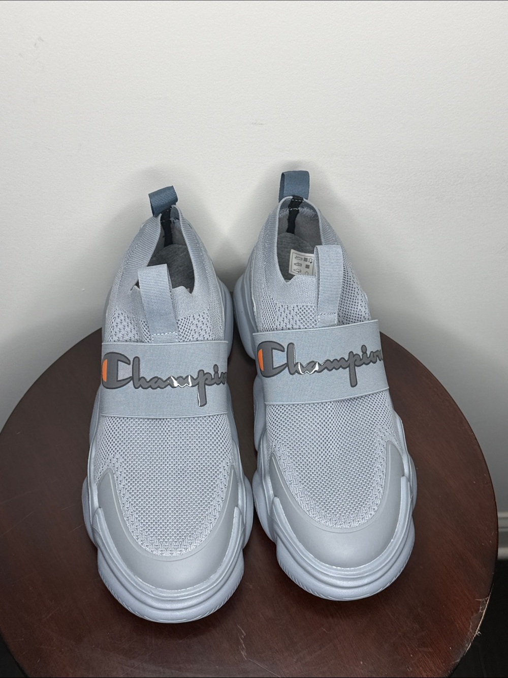 Champion Light Gray Slip-On Kids Sneakers with Orange Accent